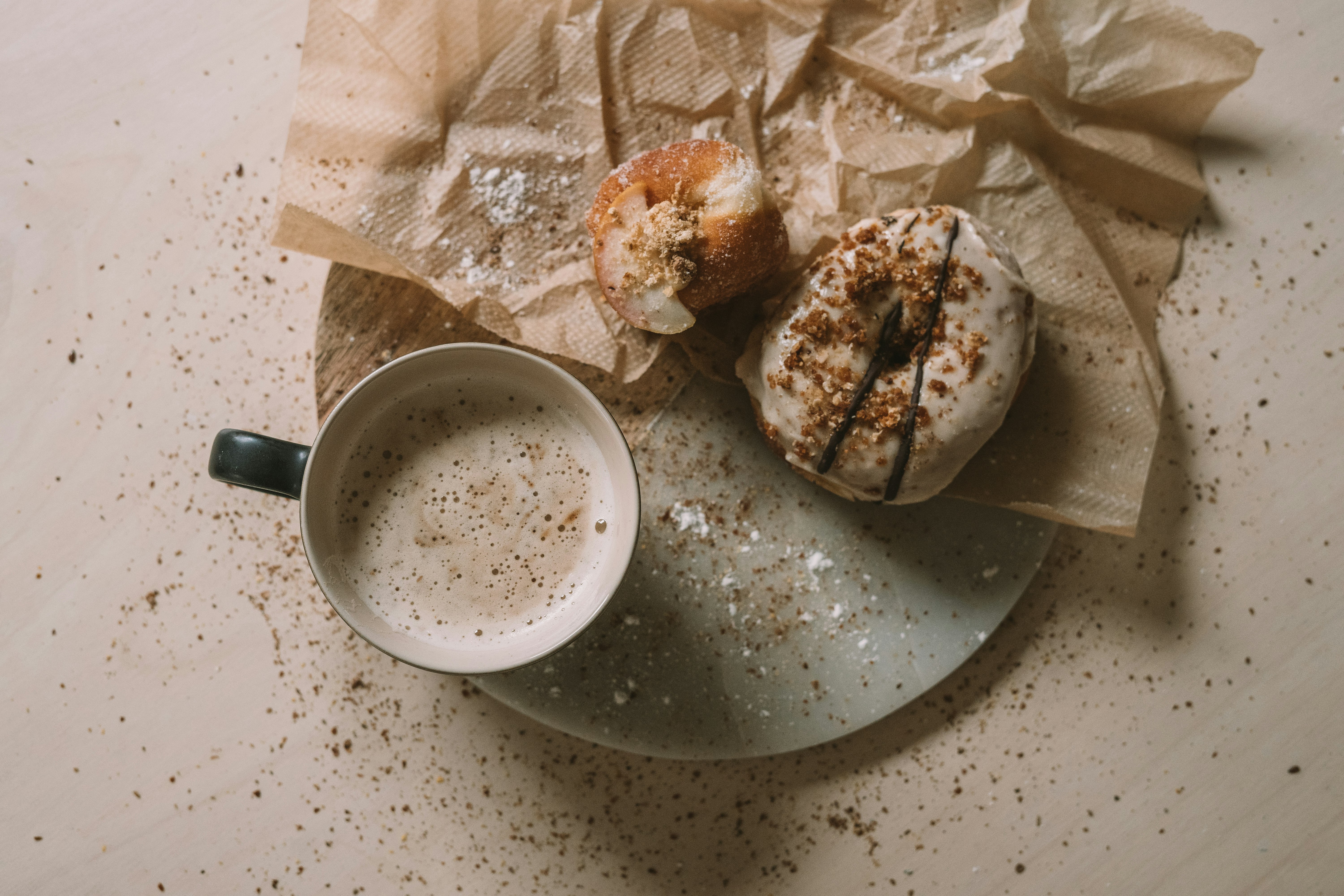 white ceramic bowl beside bread on table